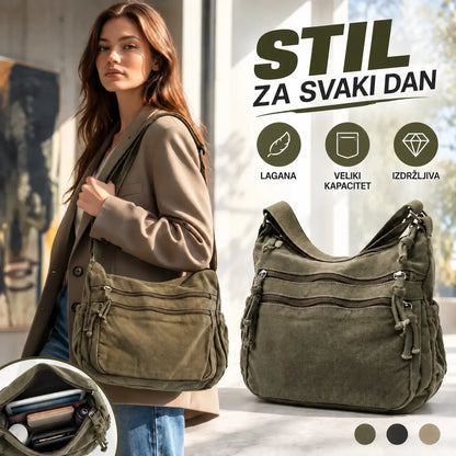 👜✨Prostrana torba za nošenje preko tijela od platna s efektom istrošenosti: odlikuje se dizajnom s više pretinaca na patentni zatvarač te širokom, podesivom naramenicom.